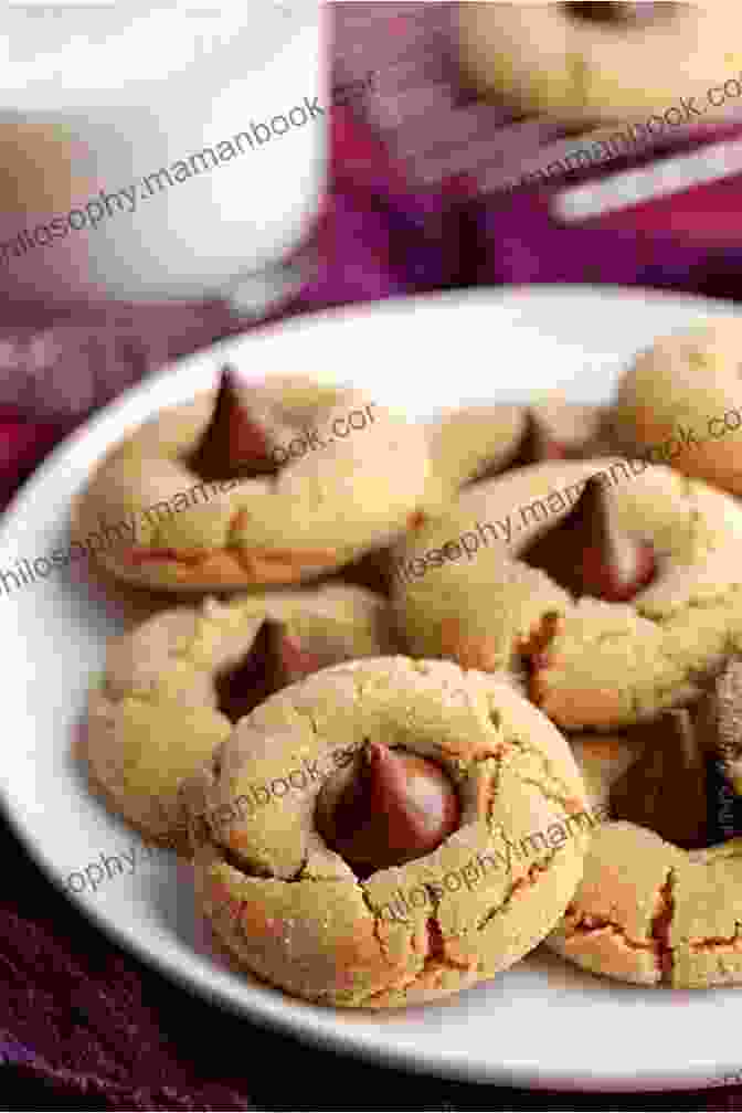 Peanut Butter Blossom Cookies Shaped Like Balls And Coated With Powdered Sugar The Best Cookies Cook For Every Kitchen With 150+ Recipes To Bake For The Holidays